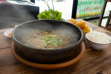 Braised pork ribs Chinese medicine in a hot pot