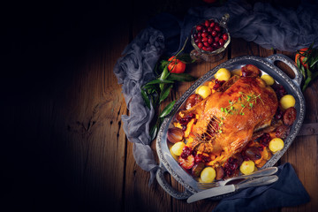 roast duck with potato dumplings and plums