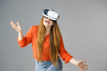 Girl wearing virtual reality goggles.