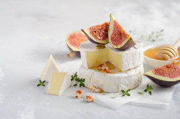 Brie or Camembert cheese with figs, thyme, honey and nuts.