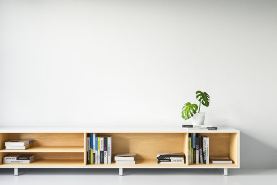 Wooden shelf with books on a background of a white wall. Mock Up. 3d rendering