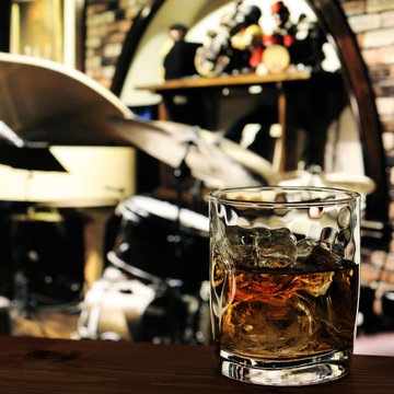 Glass Of Whiskey On The Table In Jazz Bar