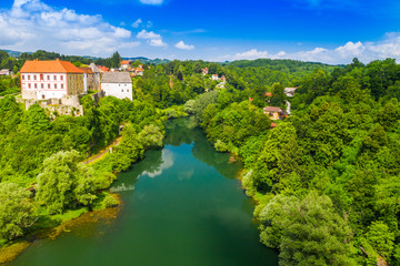 Fototapeta na wymiar Panoramic view of the river Kupa and Ozalj Castle in the town of Ozalj, Croatia, drone aerial shot