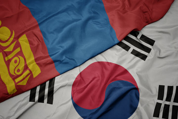 waving colorful flag of south korea and national flag of mongolia.