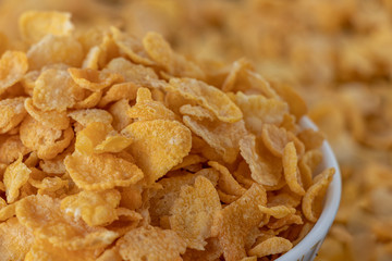 Cornflakes in blowl, a delicious and healthy dietary breakfast cereal. Selective Focus.