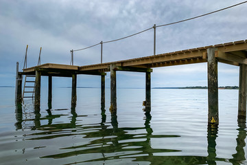 Obraz premium Reflections of a Pier on the Sea - Jutland - Denmark