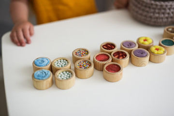 mother plays with sensory toys with child disabled