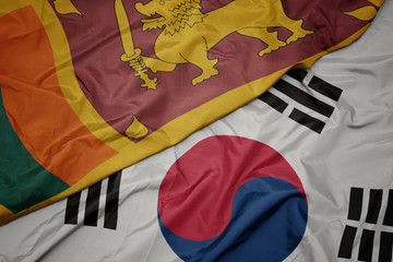 waving colorful flag of south korea and national flag of sri lanka.