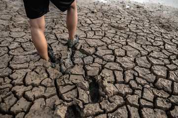 Children are walking barefoot on mud,selective focus