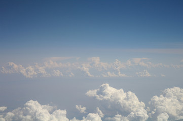 clouds and blue sky seen from plane