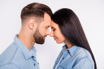 Profile side photo of charming people with their eyes closed wearing denim jeans shirt isolated over white background
