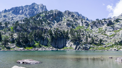 Mountains landscape with lake in summertime