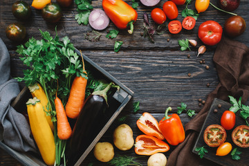 Autumn harvest of organic vegetables. Rustic table background, top view, frame.