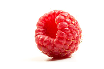 Close up of fresh raw raspberry on the white