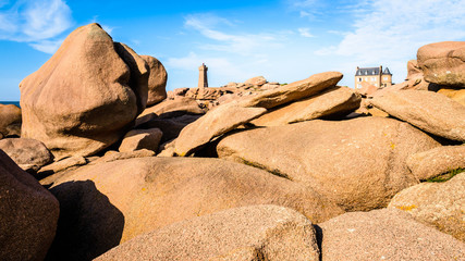 Panoramic view of the Pink Granite Coast in northern Brittany on the municipality of Perros-Guirec, France, with the Ploumanac'h lighthouse, named Mean Ruz and made of the same pink granite.