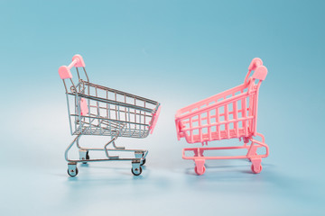 Shopping cart over blue green background