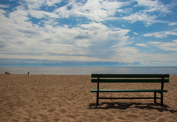 bench on the sandy seashore 