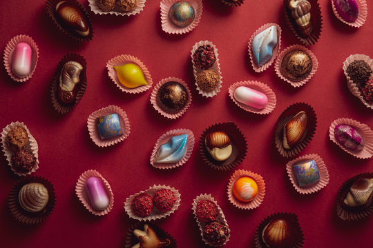 Red background with sweet chocolate candies
