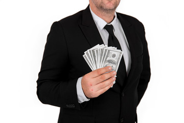 Businessman in black business suit, holding cash in hands - United stage dollar bill; clipping path - Concept of the fight against corruption - isolated on white