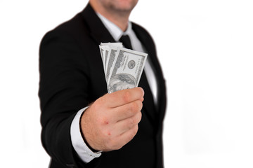 Businessman in black business suit, holding cash in hands - United stage dollar bill; clipping path - Concept of the fight against corruption - isolated on white