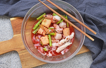 Thai street food Pink seafood flat noodles soup.(Thai name is Yentafo)