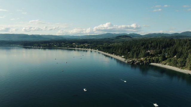 Aerial Drone Shot of Coastal Vancouver Island British Columbia Sooke on a Summer Day, Salmon Fishing Boats Along Shoreline