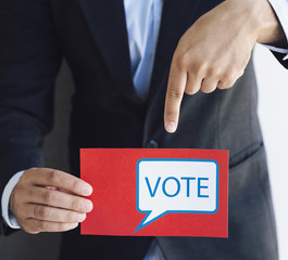 Man pointing to his ballot paper
