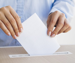 Woman holding an empty ballot mock-up