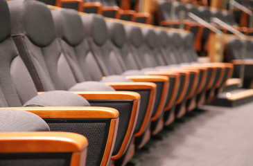 Closeup of new indoor modern designed seats rows in the theater. 