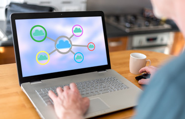 Fototapeta na wymiar Cloud networking concept on a laptop
