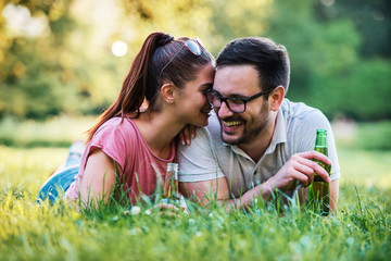 Picnic. Beautiful young couple having fun in the park. Lifestyle, love, dating concept