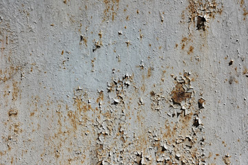 Rusty wall with cracked and peeling paint