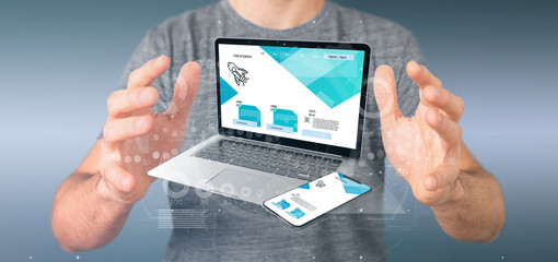 Businessman holding a Laptop and a smartphone - 3d rendering