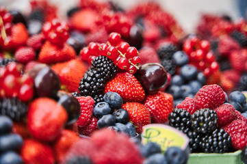 Assorted Fresh Berries in the organic street market.