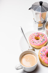 Fresh hot coffe and pink sweet donut on white background isolated