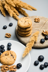 Freshly baked cookies with blackberry and nuts, studio shot