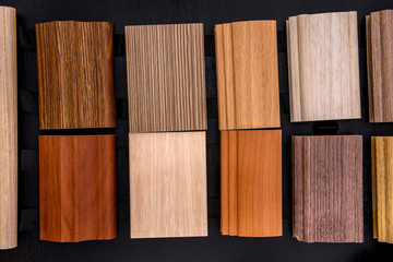 Wooden sampler on dark background close up