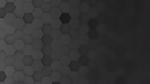 Black hexagons moving up and down in a random pattern. 3D animated motion background loop. Top down isometric view with gradual blur effect for copyspace.