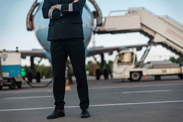 Male pilot in uniform waiting for flight