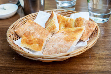 bread in basket - little roll breads in basket on table