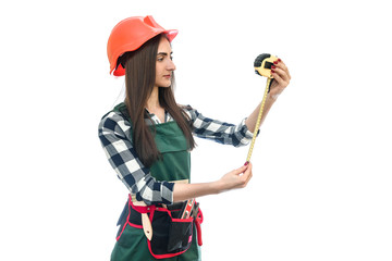 Woman in worker uniform with measuring tape isolated on white