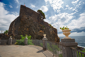 The castle perched on a spur of rock on the sea of ​​Aci Castello in Sicily, Italy.