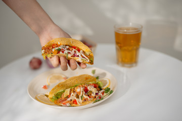 Authentic mexican tacos with beer. Mexican tacos with ground meat, beef, beans, onions and salsa