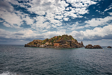 Fototapeta na wymiar Panoramic view of the island Lachea and the Ciclopi islands in Aci Trezza in Sicily, Italy.