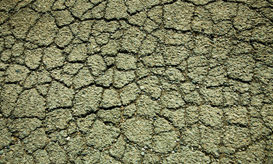 texture of cracked asphalt on the road. dark scene for background