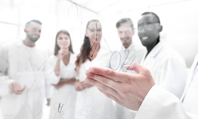 gay biologists are discussing a formula that is written on the board