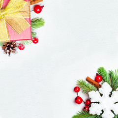 Christmas card background border composition with green Xmas fir branch, red holly berries and...