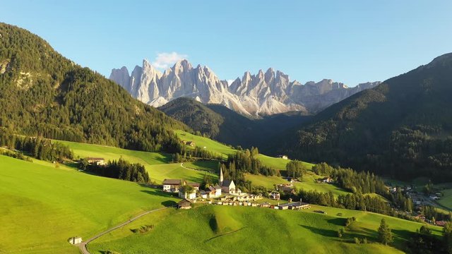 Santa Maddalena (Magdalena) village with majestic Gruppo delle Odle mountain range in the background, Val di Funes valley, Trentino Alto Adige region, Italy, Europe. Sunset in a Italian Dolomites.