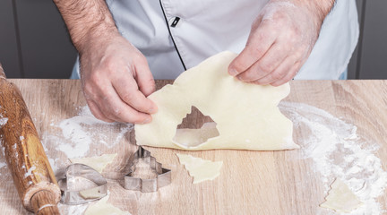 male cook preparing Christmas cookies