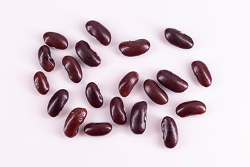 Red kidney beans in the wood box isolated on white background. 